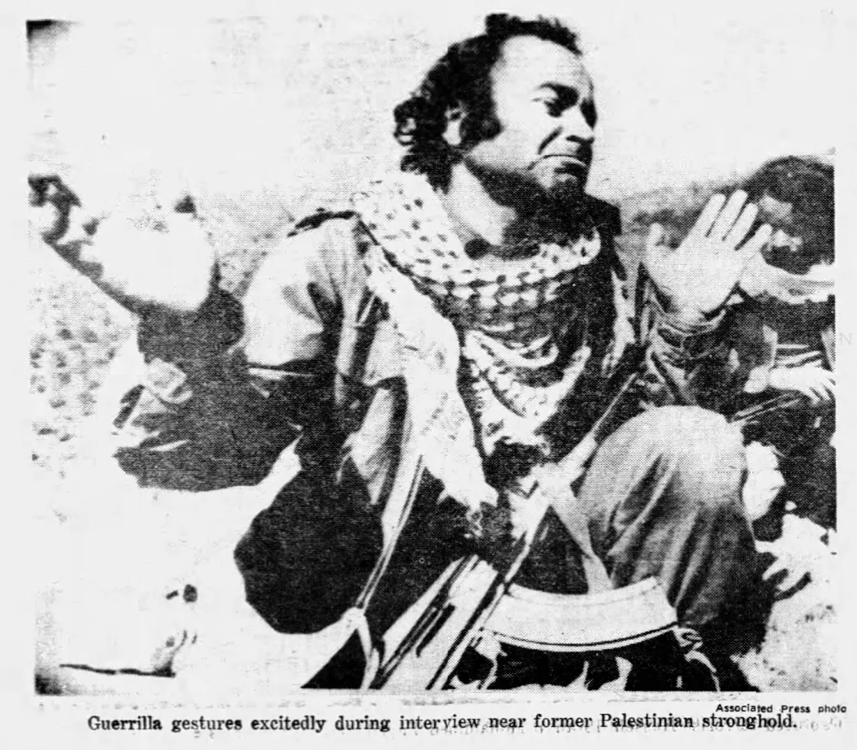 Guerrilla gestures excitedly during interview near former Palestinian stronghold &mdash; Daily News, 20 March 1978