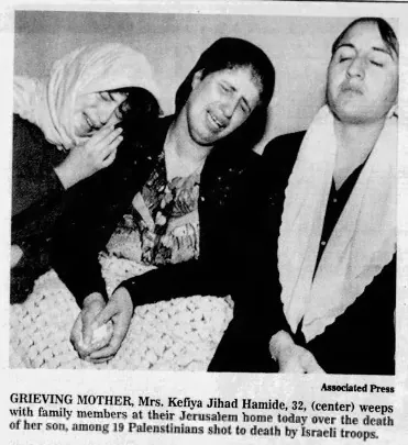 GRIEVING MOTHER, Mrs. Kefiya Jihad Hamide, 32, weeps with family members at their Jerusalem home over the death of her son, among 19 Palestinians shot to death by Israeli troops &mdash; Kentucky New Era, 9 October 1990