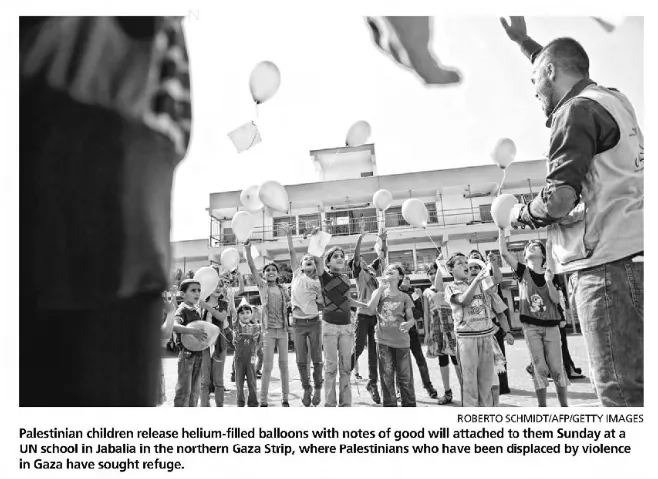 Palestinian children release helium-filled balloons with notes of good will attached to them at a UN school in Jabalia in the northern Gaza Strip, where Palestinians who have been displaced by violence in Gaza have sought refuge — Great Falls Tribune, 18 August 2014
