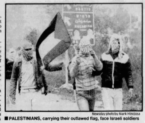 PALESTINIANS, carrying their outlawed flag, face Israeli soldiers &mdash; Times Colonist, 11 December 1988