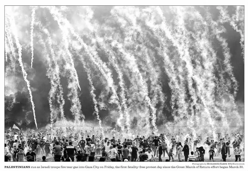 PALESTINIANS run as Israeli troops fire tear gas into Gaza City on Friday, the first fatality-free protest day since the Great March of Return effort began March 30 — Los Angeles Times, 6 May 2018